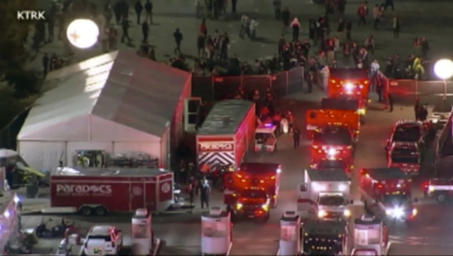 Emergency personnel respond to the Astroworld music festival in Houston on Friday, Nov. 5, 2021.  Several people died and numerous others were injured in what officials described as a surge of the crowd at the music festival while Travis Scott was performing. Officials declared a "mass casualty incident" just after 9 p.m. Friday during the festival where an estimated 50,000 people were in attendance, Houston Fire Chief Samuel Pe?a told reporters at a news conference.