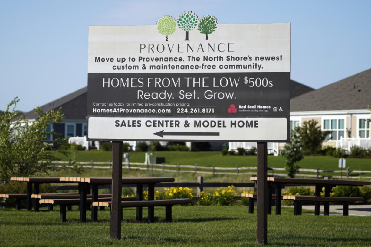 A homes sale sign is shown in front of a new home construction site in Northbrook, Ill., Wednesday, June 23, 2021. U.S. home prices rose briskly in September, another sign that the housing market is booming in the aftermath of last year's coronavirus recession. (AP Photo/Nam Y.