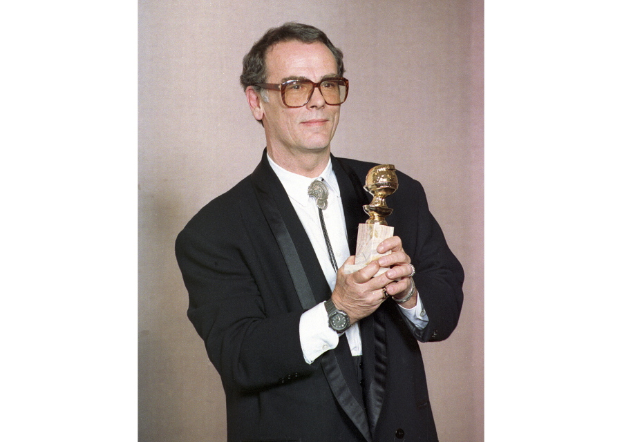 FILE - Actor Dean Stockwell poses with his award for best supporting actor for his role in "Quantum Leap" at the 47th Annual Golden Globe Awards in Los Angeles on Jan. 20, 1990. Stockwell, a top Hollywood child actor who gained new success in middle age, garnering an Oscar nomination for "Married to the Mob" and Emmy nominations for "Quantum Leap," died of natural causes at his home on Sunday, Nov. 7, 2021. He was 85.