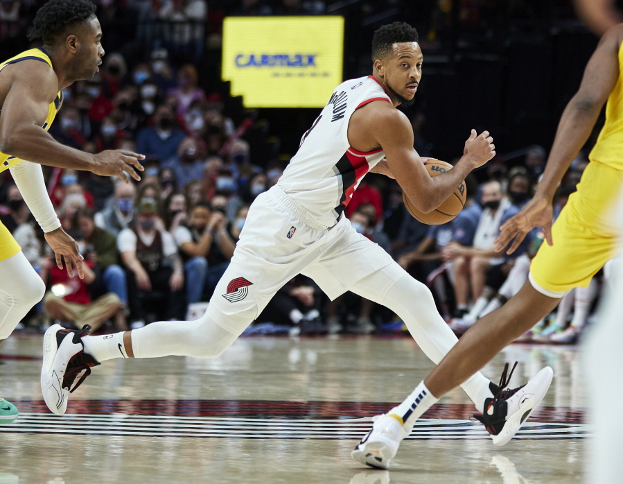Portland Trail Blazers guard CJ McCollum dribbles during the second half of the team's NBA basketball game against the Indiana Pacers in Portland, Ore., Friday, Nov. 5, 2021.