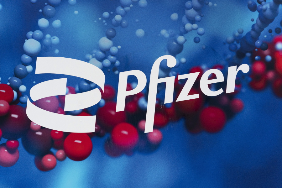 FILE - The Pfizer logo is displayed at the company's headquarters in New York, on Feb. 5, 2021. In a statement on Tuesday, Nov. 16, 2021, drugmaker Pfizer Inc. said it has signed a deal with a U.N.-backed group to allow other manufacturers to make its experimental coronavirus pill, in a move that could make its treatment available to more than half of the world's population.