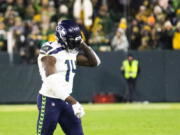 Seattle Seahawks wide receiver DK Metcalf walks off the field after being ejected in the fourth quarter during an NFL football game against the Green Bay Packers, Sunday, Nov. 14, 2021, in Green Bay, Wis.