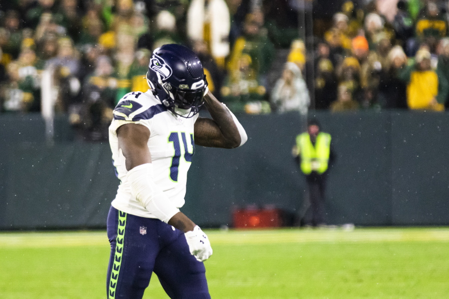 Seattle Seahawks wide receiver DK Metcalf walks off the field after being ejected in the fourth quarter during an NFL football game against the Green Bay Packers, Sunday, Nov. 14, 2021, in Green Bay, Wis.