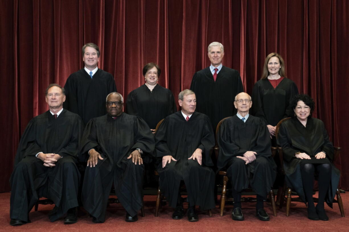 FILE - In this April 23, 2021, file photo, members of the Supreme Court pose for a group photo at the Supreme Court in Washington. Seated from left are Associate Justice Samuel Alito, Associate Justice Clarence Thomas, Chief Justice John Roberts, Associate Justice Stephen Breyer and Associate Justice Sonia Sotomayor, while standing from left are Associate Justice Brett Kavanaugh, Associate Justice Elena Kagan, Associate Justice Neil Gorsuch and Associate Justice Amy Coney Barrett.