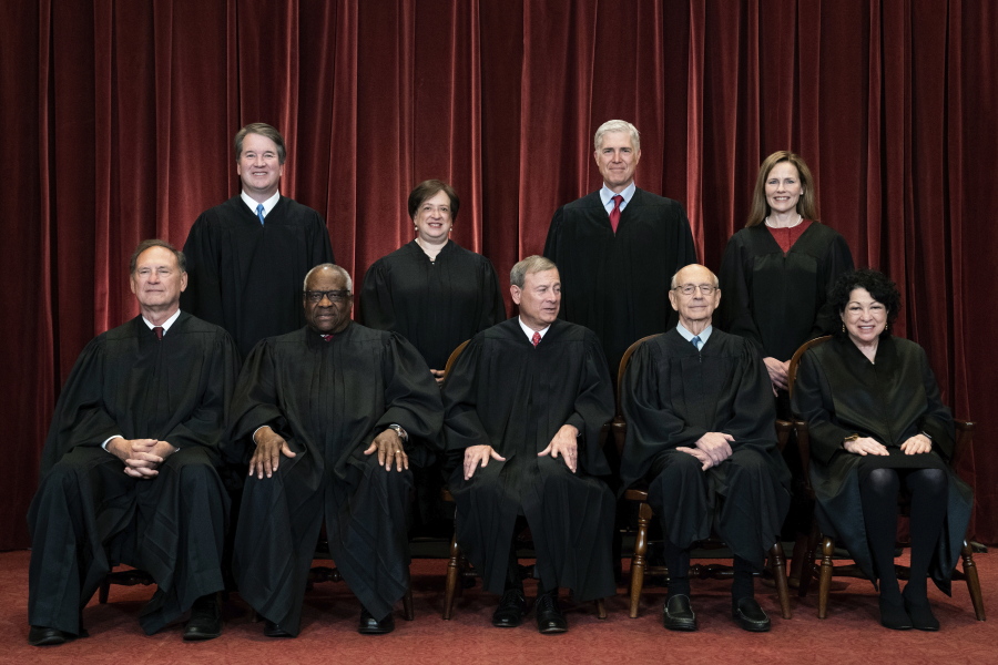 FILE - In this April 23, 2021, file photo, members of the Supreme Court pose for a group photo at the Supreme Court in Washington. Seated from left are Associate Justice Samuel Alito, Associate Justice Clarence Thomas, Chief Justice John Roberts, Associate Justice Stephen Breyer and Associate Justice Sonia Sotomayor, while standing from left are Associate Justice Brett Kavanaugh, Associate Justice Elena Kagan, Associate Justice Neil Gorsuch and Associate Justice Amy Coney Barrett.