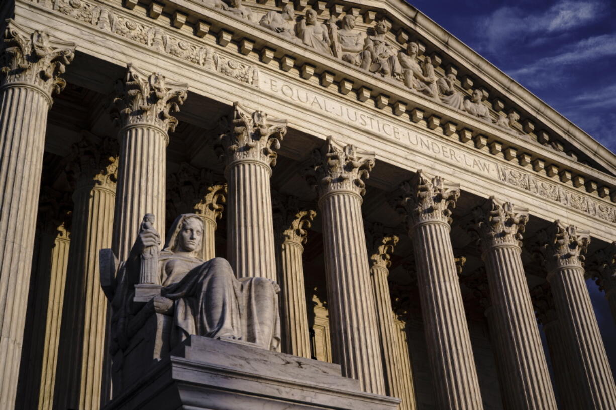 FILE - The Supreme Court is seen at dusk in Washington, Oct. 22, 2021. Both sides are telling the Supreme Court there's no middle ground in Wednesday's showdown over abortion. The justices can either reaffirm the constitutional right to an abortion or wipe it away altogether. (AP Photo/J.