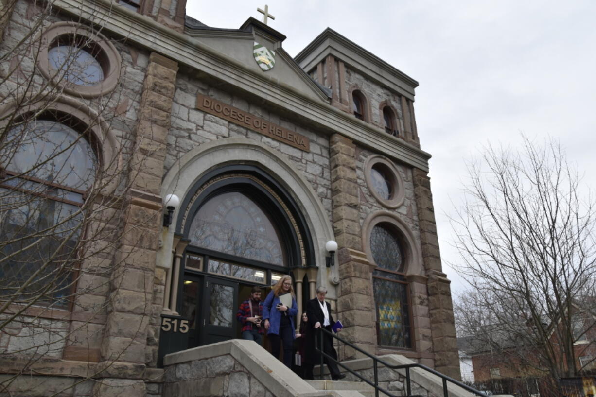 Montana Jewish Project President Rebecca Stanfel, left, and Jewish community member Erin Vang, right, leave the old synagogue Thursday in Helena, Mont. The nonprofit Montana Jewish Project purchased the building, originally built as Temple Emanu-El in 1891, from the Helena Catholic Diocese, which bought the building in 1981.