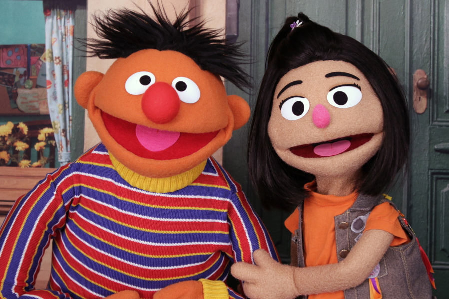 Ernie, a muppet from "Sesame Street," appears Nov. 1 with new character Ji-Young, the first Asian American muppet, on the set of the long-running children's program in New York.