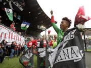 FILE - Portland Thorns goalie Karina LeBlanc, right, celebrates with teammates and fans after their 2-0 win over the Seattle Reign in a National Women's Soccer League match in Portland, Ore., April 21, 2013. The Portland Thorns have named former goalkeeper Karina LeBlanc as the team's new general manager. LeBlanc is currently the head of women's soccer for the confederation for North and Central America and Caribbean soccer. She plans to step down from that post to focus on the Thorns.  "I know women's football will continue to be a major priority at Concacaf. I am proud of how we were able to move the game forward. I loved the work I did there, but I missed being around the game, players and the energy of Portland," LeBlanc said in a statement Monday, Nov.