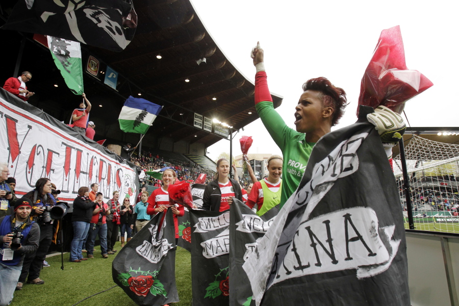 FILE - Portland Thorns goalie Karina LeBlanc, right, celebrates with teammates and fans after their 2-0 win over the Seattle Reign in a National Women's Soccer League match in Portland, Ore., April 21, 2013. The Portland Thorns have named former goalkeeper Karina LeBlanc as the team's new general manager. LeBlanc is currently the head of women's soccer for the confederation for North and Central America and Caribbean soccer. She plans to step down from that post to focus on the Thorns.  "I know women's football will continue to be a major priority at Concacaf. I am proud of how we were able to move the game forward. I loved the work I did there, but I missed being around the game, players and the energy of Portland," LeBlanc said in a statement Monday, Nov.