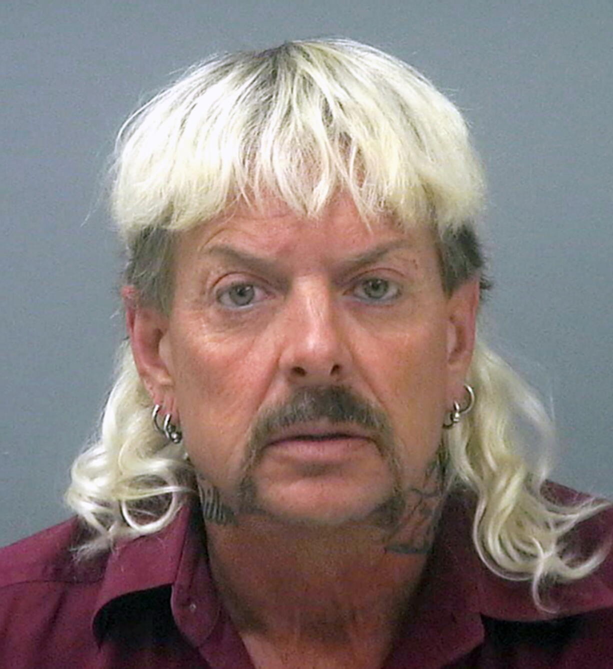 FILE - This undated file photo provided by the Santa Rose County Jail in Milton, Fla., shows Joseph Maldonado-Passage, also known as Joe Exotic.