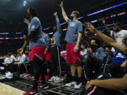 Portland Trail Blazers players celebrate after a three-pointer during the first half of an NBA basketball game against the Los Angeles Clippers in Los Angeles, Tuesday, Nov. 9, 2021.