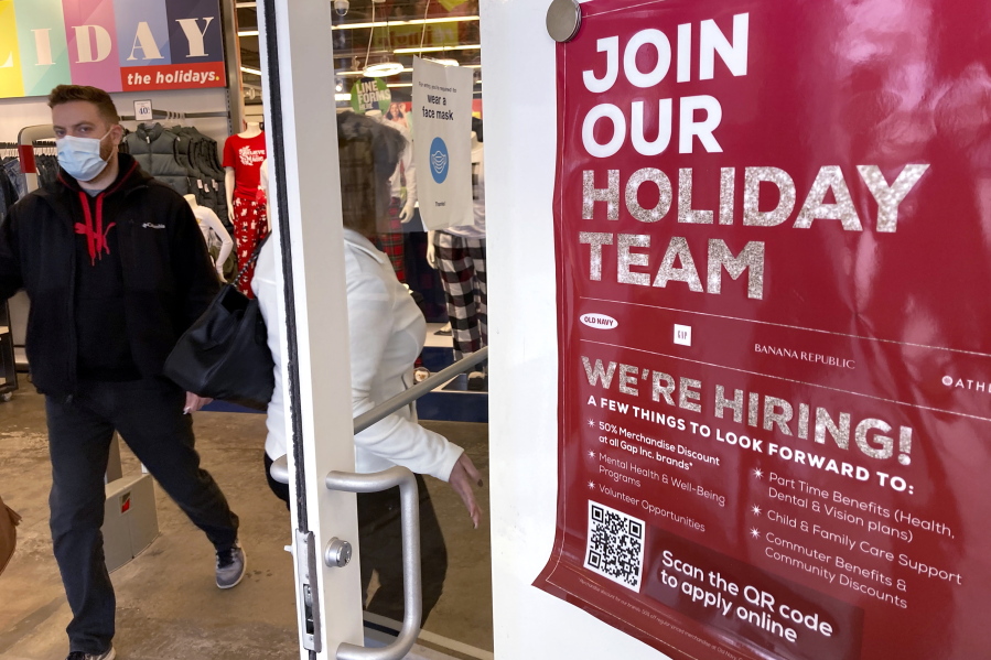 Holiday hiring sign is displayed at a retail store in Vernon Hills, Ill., Saturday, Nov. 13, 2021. The number of Americans applying for unemployment benefits fell for the seventh straight week to a pandemic low 268,000. U.S. jobless claims dipped by 1,000 last week from the week before, the Labor Department reported Thursday, Nov. 18. (AP Photo/Nam Y.
