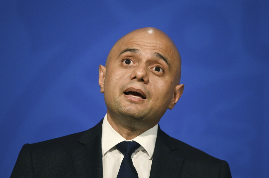 FILE - Britain's Health Secretary Sajid Javid speaks during a media briefing in Downing Street, London, Wednesday, Oct. 20, 2021. The British government is investigating whether built-in racial bias in some medical devices led to Black and Asian people getting sick and dying disproportionately from COVID-19. Health Secretary Sajid Javid says the pandemic has highlighted health disparities along race and gender lines. Britain's statistics office has found that in the first year of the pandemic Black and South Asian people had higher death rates than their white compatriots.