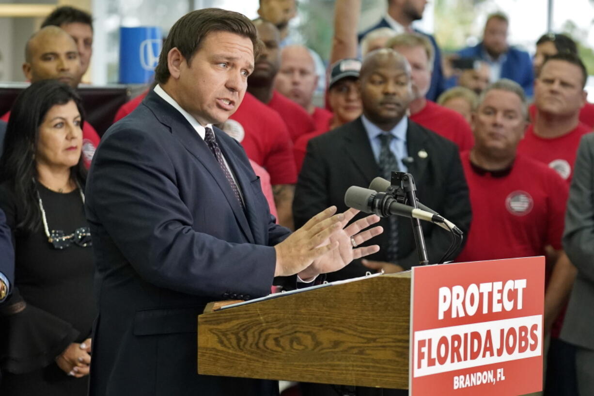 Florida Gov. Ron DeSantis speaks to supporters and members of the media before a bill signing Thursday, Nov. 18, 2021, in Brandon, Fla. DeSantis signed a bill that protects employees and their families from coronavirus vaccine and mask mandates.