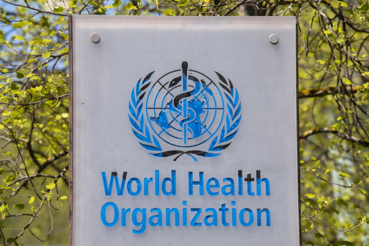 FILE - The logo of the World Health Organization, WHO, is displayed at the  headquarters in Geneva, Switzerland, April 15, 2020. The World Health Organization is opening a long-planned special session of member states to discuss ways to strengthen the global fight against pandemics like the coronavirus, just as the worrying new omicron variant has sparked immediate concerns worldwide.
