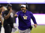 FILE - Washington head coach Jimmy Lake yells toward the field in the first half of an NCAA college football game against California, Saturday, Sept. 25, 2021, in Seattle. Washington on Monday, Nov. 8 suspended head coach Jimmy Lake for one game without pay following a sideline incident during the Huskies' game against Oregon.
