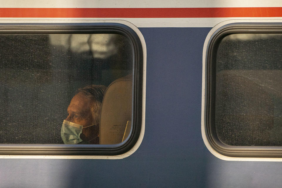 A passenger looks out the window of an Amtrak train at King Street Station on November 15, 2021 in Seattle, Washington. Regional rail is having a resurgence in the U.S.