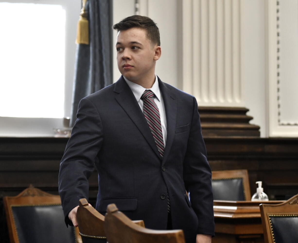 Kyle Rittenhouse looks back to the gallery during a break in testimony from Gage Groskreutz during his trial at the Kenosha County Courthouse in Kenosha, Wis., on Monday, Nov. 8, 2021.