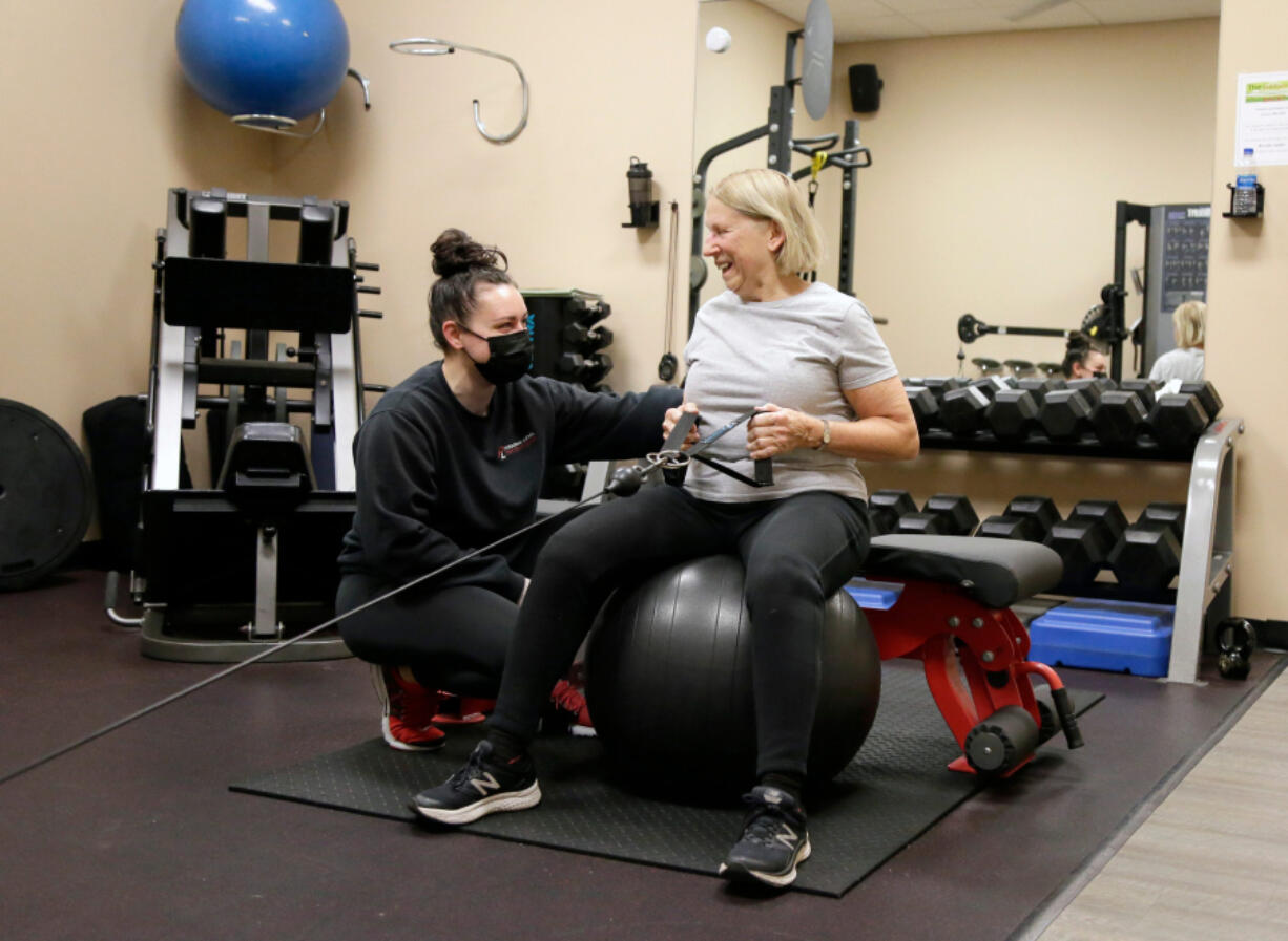 Mo Golden, NASM CPT, works Dec. 14 with Marcia Ouellette 80,of Upper Arlington at Personal Level Fitness in Columbus, Ohio. (Barbara J.