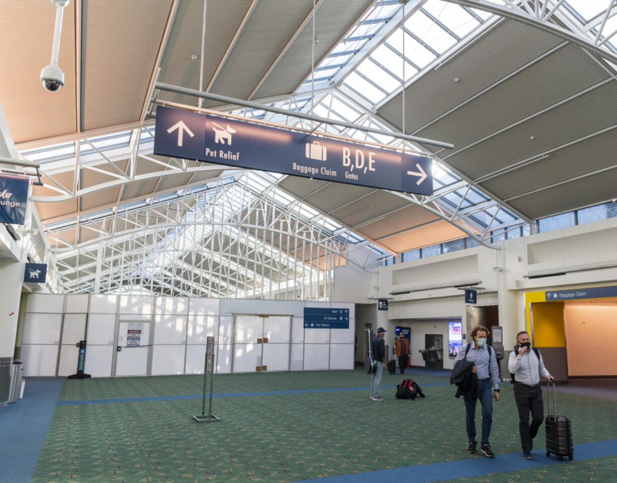 A wall blocks Concourse C from its adjoining node, which is home to the security area for the B and C gates. Travelers now walk through security and then around the node using a bypass hallway.