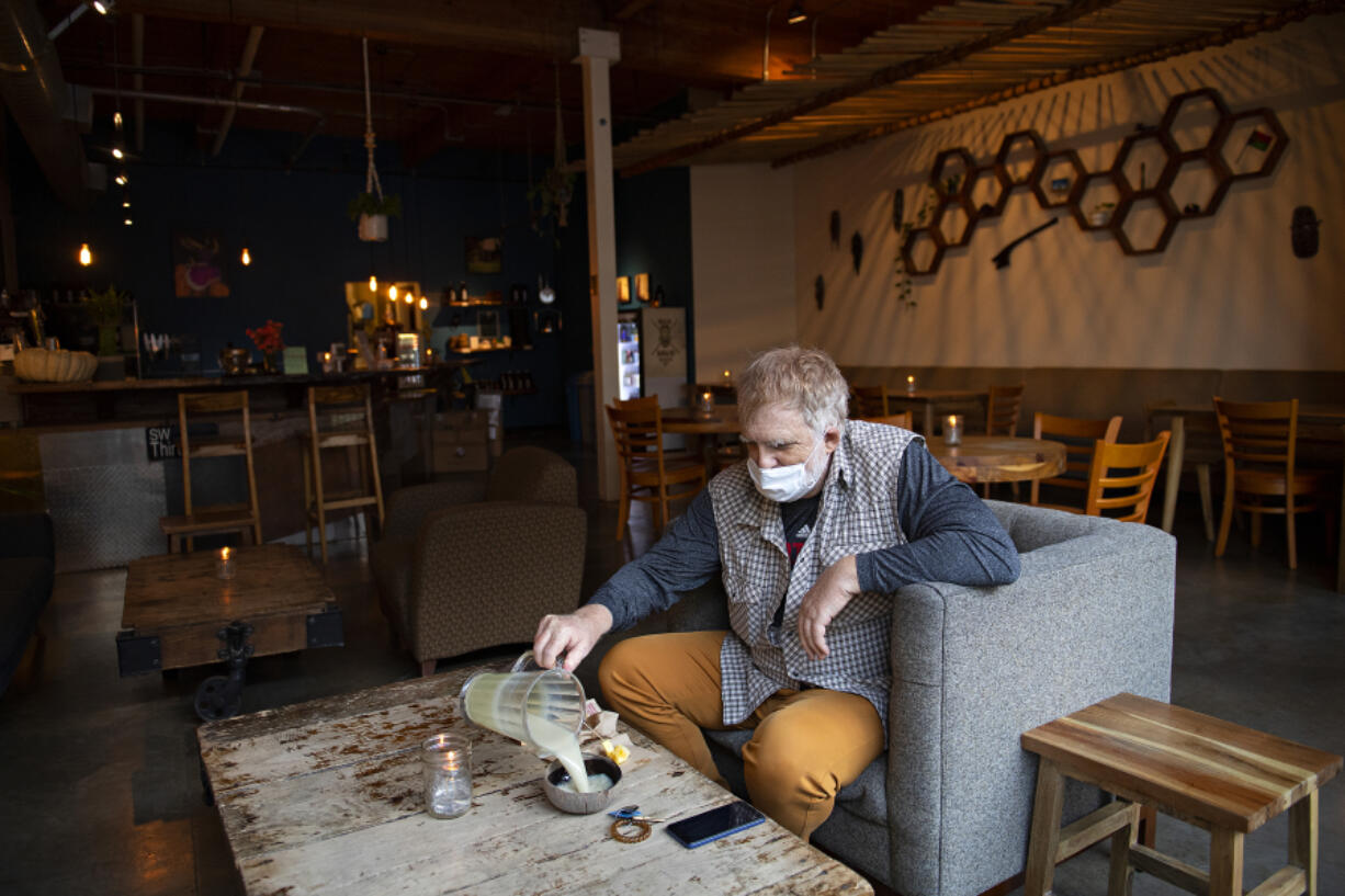 Portland resident Marco McLean enjoys a relaxing morning while visiting Bula Kava House in Southeast Portland. The bar's owner is planning a second location in downtown Vancouver.