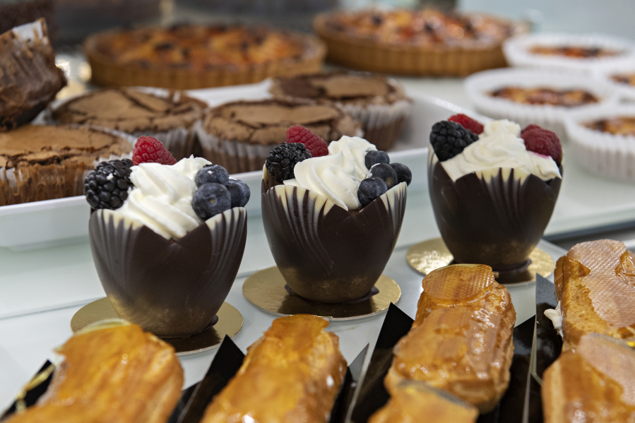 Chocolate mousse cups are among the treats on display at Baron Patisserie. The bakery also sells croissants, Danishes, cinnamon rolls, brioche pastries, cookies, frangipane tarts, dense chocolate cakes and chocolate mousse cakes.