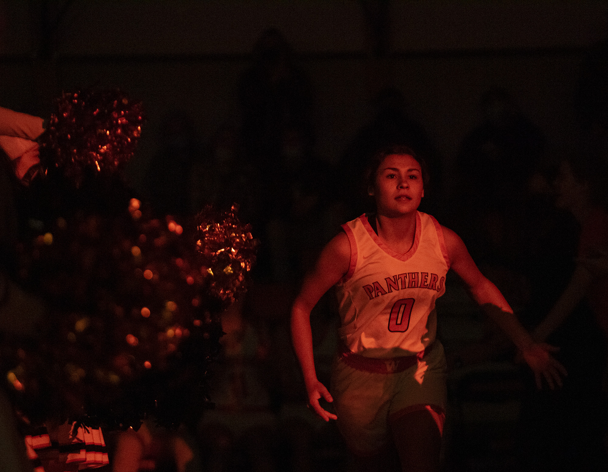 Washougal junior Chloe Johnson runs across the court during pregame introductions on Tuesday, Dec. 14, 2021, before the Panthers’ 57-54 win against Hudson’s Bay at Washougal High School.
