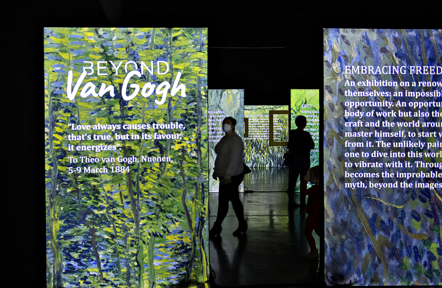 Colorful panels on the way in to "Beyond Van Gogh" at the Oregon Convention Center tell the story of the artist's life and quote from letters he wrote his brother, Theo.