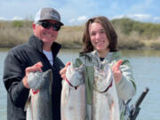 Happy clients with spring Chinook they caught while fishing with guide Matt Eleazer of East Fork Outfitters last year. With the runs improving in almost all waters, local anglers should be in store for much better fishing this spring and summer.