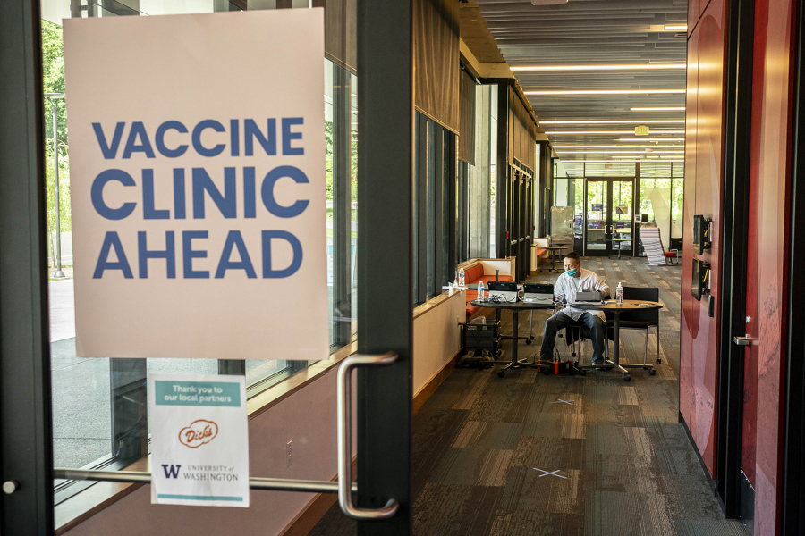 A pharmacist waits for patients at a COVID-19 vaccination clinic on the University of Washington campus on May 18 in Seattle.