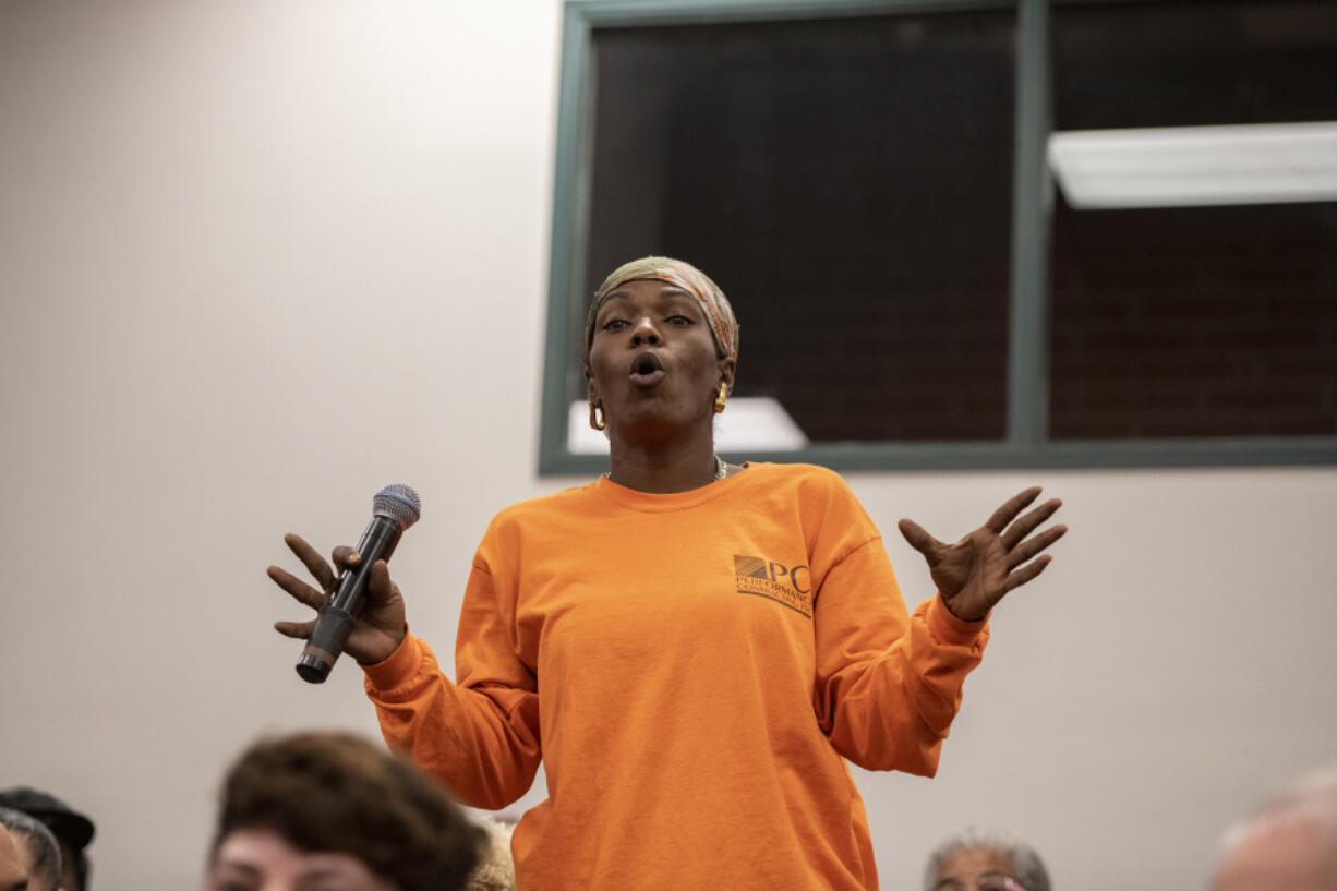 Nickeia Hunter poses a question regarding police brutality at Clark College's Foster Hall auditorium during a Police Executive Research Forum on Sept. 11, 2019. Hunter, whose brother was fatally shot by Vancouver police officers in March 2019 in Hazel Dell, was recently appointed to the 16-member Washington State Criminal Justice Training Commission.