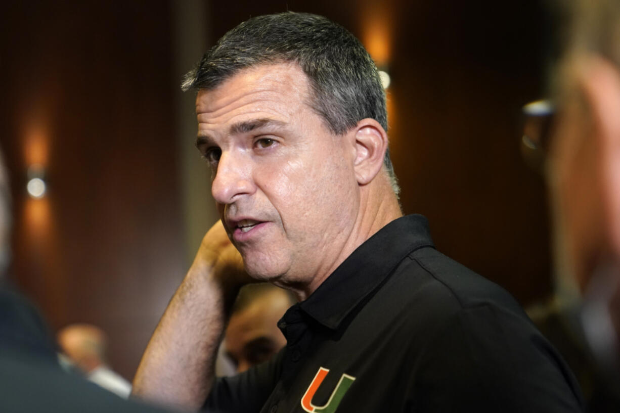 Miami head football coach Mario Cristobal is shown following a news conference where Director of Athletics Dan Radakovich was introduced, Tuesday, Dec. 14, 2021, in Coral Gables, Fla.