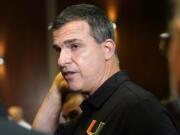 Miami head football coach Mario Cristobal is shown following a news conference where Director of Athletics Dan Radakovich was introduced, Tuesday, Dec. 14, 2021, in Coral Gables, Fla.