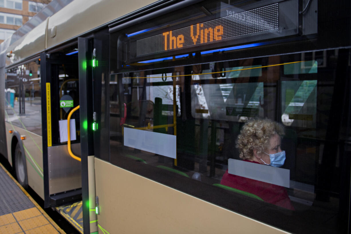 Heather Manning of Vancouver sits aboard a C-Tran Vine bus headed east from the Turtle Place Transit Station on Feb. 22. Passenger count has rebounded on local routes even though the pandemic continues.