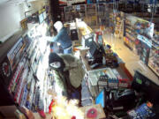 Two people can be seen on surveillance video stealing tobacco products from the 7 Market in Camas this week, according to the Camas Police Department. Police also linked the pair to two similar convenience store burglaries in Washougal.