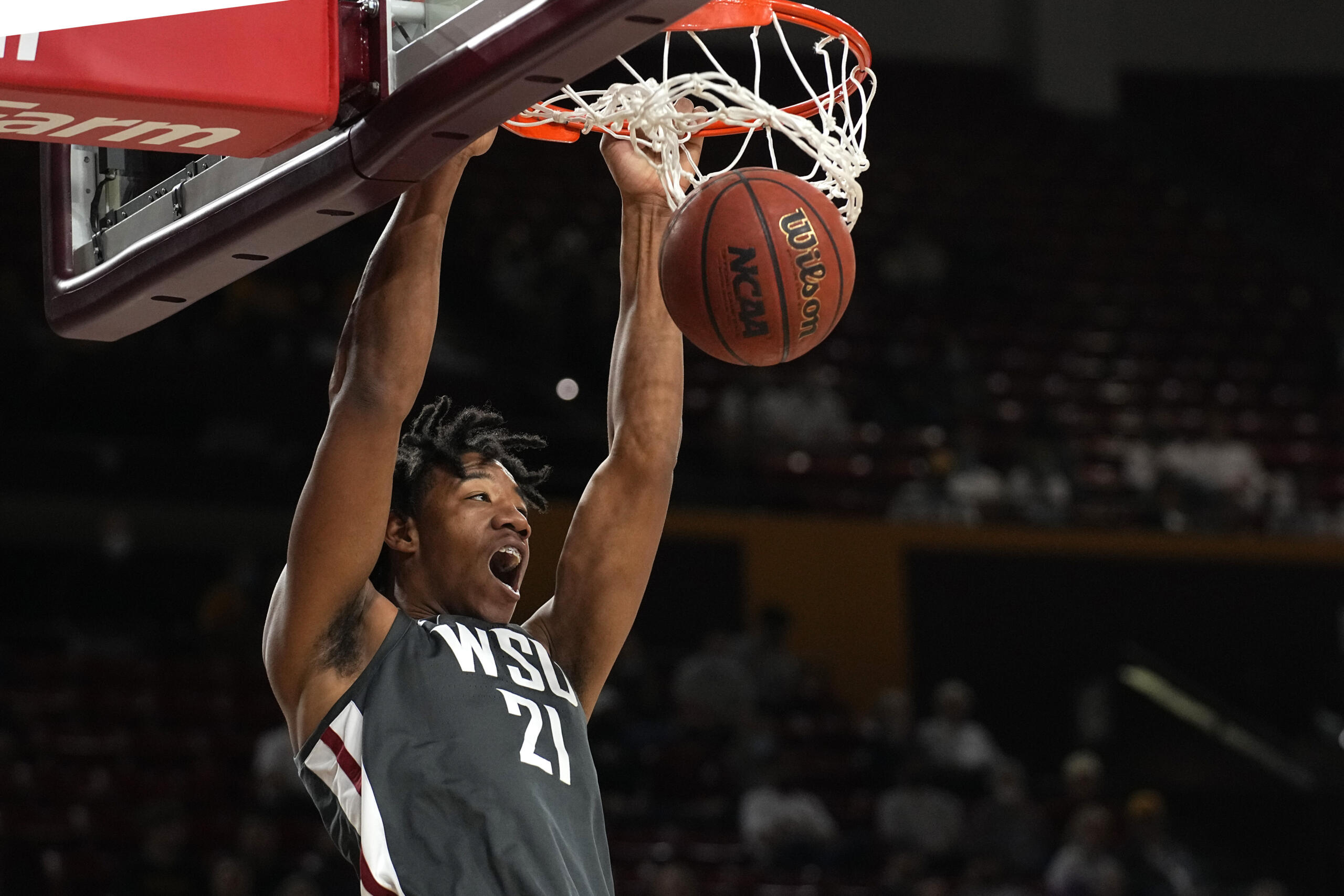 Washington State center Dishon Jackson dunks against Arizona State during the first half of an NCAA college basketball game, Wednesday, Dec. 1, 2021, in Tempe, Ariz.