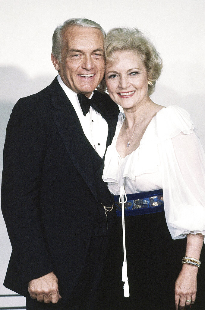 FILE - Actress Betty White stands with Ted Knight at the Emmy Awards in Los Angeles on Sept. 13, 1981. Betty White, whose saucy, up-for-anything charm made her a television mainstay for more than 60 years, has died. She was 99.