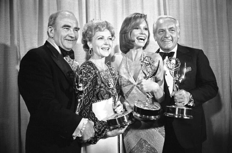 FILE - In this May 18, 1976 file photo, cast members of the "Mary Tyler Moore Show," pose with their Emmys backstage, at the 28th annual Emmy Awards in Los Angeles. From left are, Ed Asner, Betty White, Mary Tyler Moore and Ted Knight.  Betty White, whose saucy, up-for-anything charm made her a television mainstay for more than 60 years, has died. She was 99.