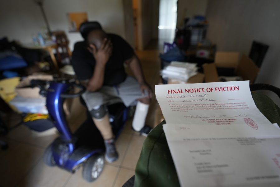 Freddie Davis, whose landlord raised his rent by 60 percent in the same month he lost his job as a truck driver, waits for a friend to arrive to help him move his remaining belongings to a storage unit, after receiving a final eviction notice at his one-bedroom apartment, Wednesday, Sept. 29, 2021, in Miami. "I never thought I'd be in this situation. I've been working my whole life," said Davis, who lost a leg to diabetes, suffers from congestive heart failure, and is recovering from multiple wounds on his other leg and foot.