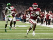 Oklahoma running back Kennedy Brooks (26) runs for a touchdown against Oregon during the first half of the Alamo Bowl NCAA college football game Wednesday, Dec. 29, 2021, in San Antonio.
