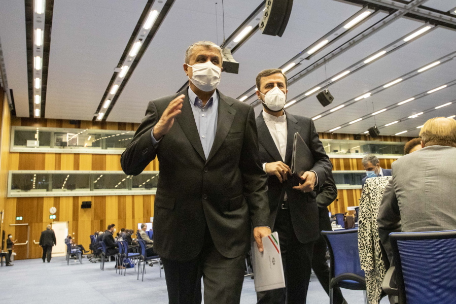 FILE - Mohammad Eslami, new head of Iran's nuclear agency (AEOI), left, and Iran's Governor to the International Atomic Energy Agency (IAEA), Kazem Gharib Abadi, left, leave the International Atomic Energy's (IAEA) General Conference in Vienna, Austria, Monday, Sept. 20, 2021. Diplomats negotiating in Vienna to revive Iran's 2015 nuclear deal with world powers have paused after a five days of talks to consult with their governments and will reconvene next week, officials said Friday.
