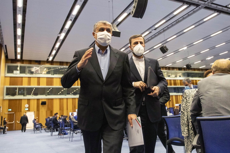 FILE - Mohammad Eslami, new head of Iran's nuclear agency (AEOI), left, and Iran's Governor to the International Atomic Energy Agency (IAEA), Kazem Gharib Abadi,  leave the International Atomic Energy's (IAEA) General Conference in Vienna, Austria, Monday, Sept. 20, 2021. The European diplomat chairing nuclear talks between Iran and world powers says negotiations in Vienna will resume Thursday, Dec. 9, 2021. Enrique Mora tweeted Wednesday that the parties to the 2015 Vienna accord will meet in the Austrian capital after consulting with their governments in recent days.
