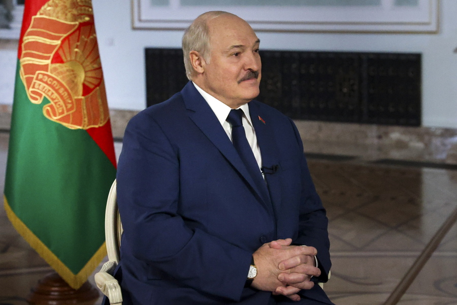 CORRECTS DATE  Belarusian President Alexander Lukashenko speaks during his interview with Russia's Rossiya Segodnya agency, also known as Sputnik, news agency head Dmitry Kiselev in Minsk, Belarus, Tuesday, Nov. 30, 2021.
