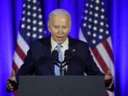 President Joe Biden speaks at a Democratic National Committee holiday party, Tuesday, Dec. 14, 2021, in Washington.