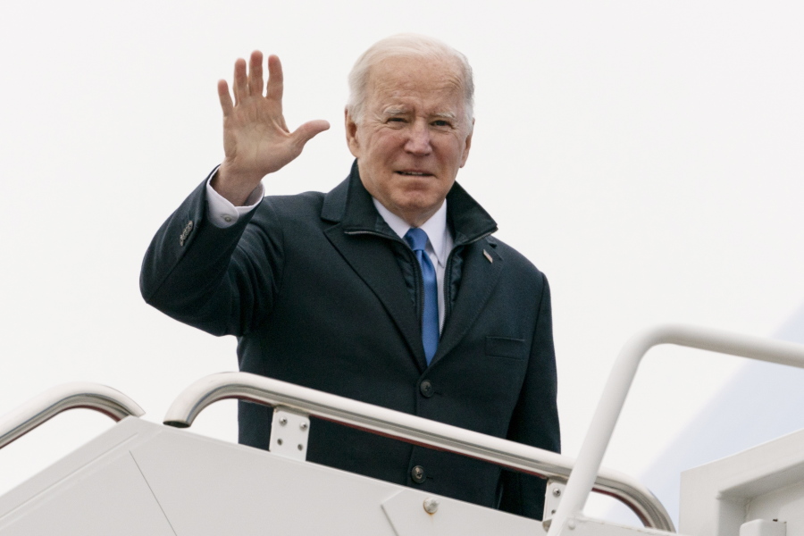 President Joe Biden waves as he boards Air Force One upon departure, Wednesday, Dec. 8, 2021, at Andrews Air Force Base, Md. Biden is en route to Kansas City, Mo.