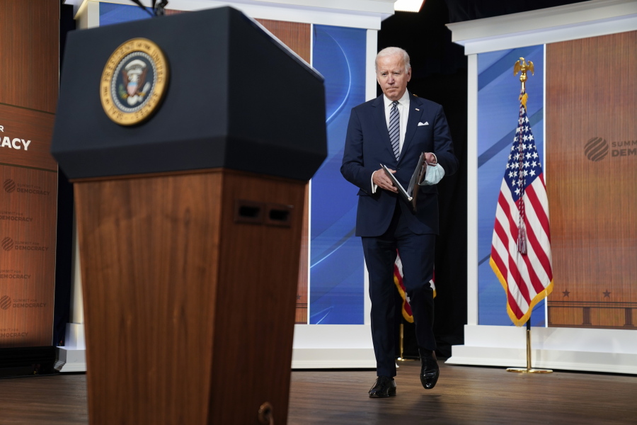 President Joe Biden arrives to deliver closing remarks to the virtual Summit for Democracy, in the South Court Auditorium on the White House campus, Friday, Dec. 10, 2021, in Washington.