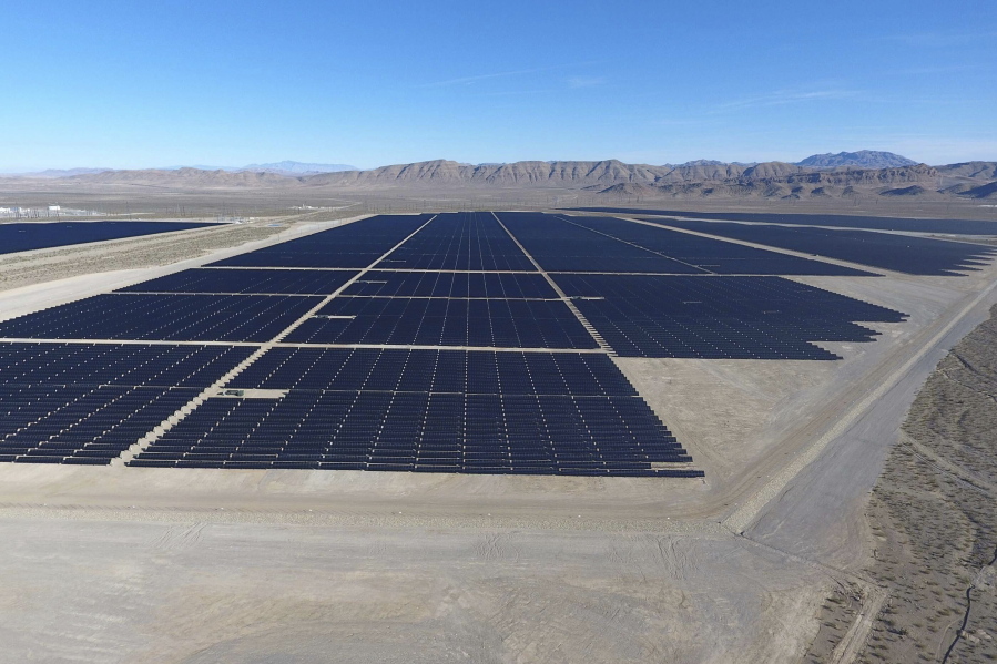 FILE - In this Dec. 11, 2017, file photo, solar arrays line the desert floor of the Dry Lake Solar Energy Zone as part of the 179 megawatt Switch Station 1 and Switch Station 2 Solar Projects north of Las Vegas. The Biden administration on Tuesday, Dec. 21, 2021, issued a solicitation for interest in developing solar power on public lands in Nevada, New Mexico and Colorado.