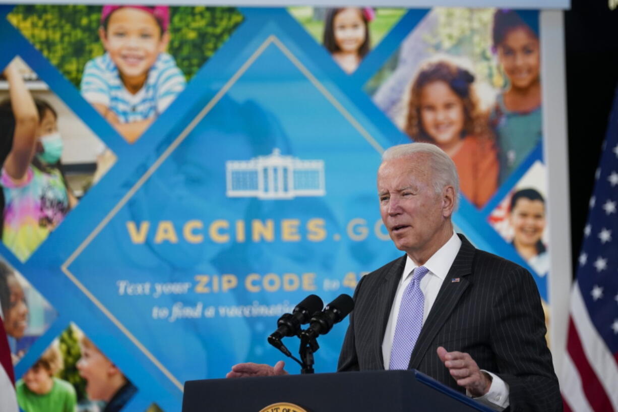 FILE - President Joe Biden talks about the newly approved COVID-19 vaccine for children ages 5-11 from the South Court Auditorium on the White House complex in Washington, Wednesday, Nov. 3, 2021.  Millions of health care workers across the U.S. were supposed to have their first dose of a COVID-19 vaccine by this coming Monday, Dec. 6 under a mandate from President Joe Biden's administration. But that has been placed on hold by federal judges.