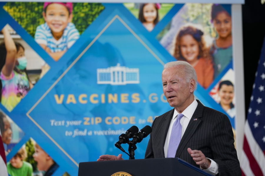 FILE - President Joe Biden talks about the newly approved COVID-19 vaccine for children ages 5-11 from the South Court Auditorium on the White House complex in Washington, Wednesday, Nov. 3, 2021.  Millions of health care workers across the U.S. were supposed to have their first dose of a COVID-19 vaccine by this coming Monday, Dec. 6 under a mandate from President Joe Biden's administration. But that has been placed on hold by federal judges.